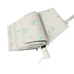 Parapluie automatique pliable fleuri, motif floral élégant, léger et pratique, parfait pour protéger de la pluie avec style.