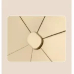 Parapluie de luxe beige avec sommet détaillé, design vintage et moderne, structure soignée, idéal pour élégance et protection.