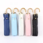 Parapluie pliant 6 baleines, collections élégantes : bleu marine, bleu clair, blanc, rose, noir, avec poignées dorées modernes.