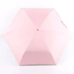 Parapluie pliant rose 6 baleines avec bordure scallopée, élégant et pratique, idéal pour la pluie et un style raffiné.