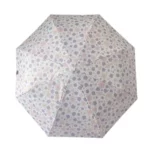 Parapluie pliant violet à motifs floraux pastel, design élégant avec structure octogonale, idéal pour accessoiriser votre tenue.