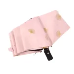 Parapluie rose pliable avec motifs feuille de ginkgo, poignée noire, élégant et résistant pour toutes les collections mode