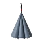 Parapluie tempête double couche gris, design élégant et résistant, manche noir et rouge, idéal pour toutes les conditions météo.