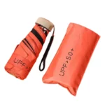 Mini parapluie léger pliable orange avec housse, protection UPF 50+, pratique pour la pluie et le soleil, idéal à emporter.