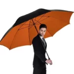 Parapluie XXL pliable 185 cm noir et orange, élégant accessoire de protection contre la pluie, idéal pour toutes occasions.