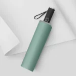 Parapluie anti-UV original vert menthe, compact et pratique, parfait pour la protection solaire et les intempéries. Design moderne.