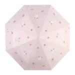 Parapluie enfant rose avec motifs lapin et pattes, accessoire mignon et pratique, idéal pour protéger les petits sous la pluie.