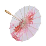 Parapluie japonais floral avec dégradé rose, structure en bambou, motif élégant, idéal pour touches authentiques et raffinées.