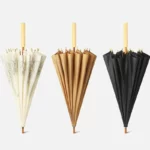 Parapluie japonais longue poignée, design élégant : motifs crème, marron uni et noir classique avec poignées en bois artisanal.