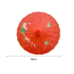 Parapluie japonais vintage avec design floral rouge, 56 cm, élégant et pratique pour allier style traditionnel et protection contre la pluie.