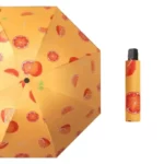Parapluie original motif orange sur fond jaune, compact, léger et pratique, idéal pour une touche fruitée sous la pluie.