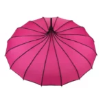 Parapluie rose vintage avec coutures noires, design original et élégant, parfait pour les fans de style rétro et tendance.