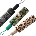 Parapluies pliants design : mandala noir, motif coloré artistique et léopard, alliant élégance et protection contre la pluie.