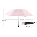 Parapluie pliant fleuri rose, compact et élégant, 96 cm de diamètre, idéal pour se protéger efficacement de la pluie.