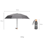 Parapluie pliant compact gris, 95 cm large, 60 cm haut, 300 g, avec housse 23 cm, idéal pour voyage ou usage quotidien.