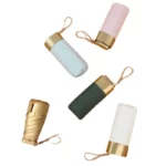 Petit parapluie chic et compact, couleurs pastel (bleu, rose, vert, blanc), poignée dorée élégante, parfait pour toutes saisons.