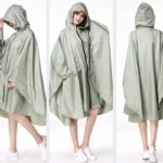 Poncho femme zip élégant vert clair avec capuche, style moderne et pratique, parfait pour la pluie et toutes occasions.