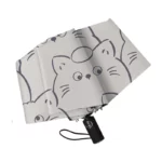Parapluie automatique pliant avec un motif de chats adorables sur fond gris, pratique et élégant pour toutes les saisons.