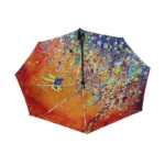 Parapluie automatique coloré avec motif artistique d'oiseau sur fond orange, accessoire tendance pour illuminer les jours de pluie.