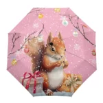 Parapluie automatique écureuil, décor de Noël avec neige, cadeaux et écureuil mignon sur fond rose.