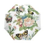 Parapluie automatique fleuri avec motifs roses et papillons, accessoire chic pour allier élégance et protection contre la pluie.