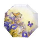 Parapluie automatique élégant avec motifs de papillons colorés, idéal pour se protéger de la pluie tout en restant stylé.