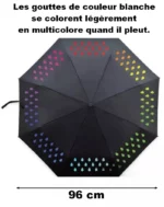 Parapluie noir 96 cm avec gouttes blanches devenant multicolores sous la pluie, design unique et élégant pour les jours pluvieux.