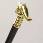 Parapluie canne résistant avec poignée tête d'éléphant en métal doré, design élégant et raffiné pour un style intemporel.