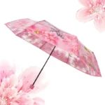 Parapluie femme floral transparent avec motifs roses, alliant élégance et praticité pour un style unique sous la pluie.