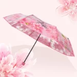 Parapluie femme transparent avec imprimé floral rose, design élégant et tendance pour rester protégée de la pluie avec style.