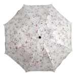 Parapluie pliable pour femme, design élégant avec motifs floraux rouges, pratique et stylé pour se protéger de la pluie.