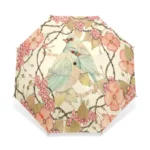 Parapluie femme romantique avec motifs floraux et oiseaux stylisés, alliant élégance et protection contre la pluie. Design raffiné.
