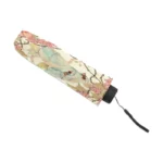 Parapluie femme romantique pliable, motif floral et oiseaux, élégant et pratique pour une touche de charme sous la pluie.