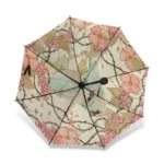 Parapluie femme romantique avec motif floral et oiseau, élégant et pratique pour une protection stylée contre la pluie.