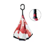 Parapluie inversé femme au motif floral rouge, design élégant et pratique, parfait pour se protéger de la pluie avec style.