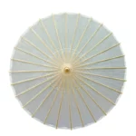 Parapluie japonais élégant avec toile légère et rayons dorés, alliant protection contre la pluie et raffinement esthétique.