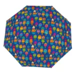 Parapluie original à motifs de glaces colorées sur fond bleu, accessoire fun et pratique pour illuminer les journées pluvieuses.