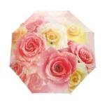 Parapluie pliable orné de roses roses et jaunes sur fond pastel, élégant et pratique, idéal pour un look chic sous la pluie.