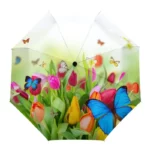 Parapluie élégant avec motifs de papillons et fleurs colorées, pour un style printanier et joyeux. Idéal pour illuminer la pluie.