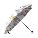 Parapluie pliant à 3 plis avec motif floral coloré, nuances de jaune, violet, bleu et rose, parfait pour un look élégant sous la pluie.