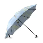 Parapluie pliant de poche bleu avec motif feuillage, compact et élégant, idéal pour la pluie et facile à transporter.
