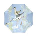 Parapluie pliant de poche avec motifs d'oiseaux au bord de l'eau sur fond bleu clair, compact et pratique pour la pluie.