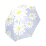 Parapluie pliant de voyage à motif de marguerites blanches sur fond bleu clair, élégant et pratique pour affronter la pluie.