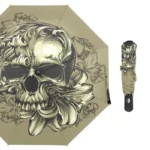 Parapluie pliant gothique avec motif tête de mort et floraux, élégant et pratique, idéal pour un style unique sous la pluie.