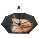 Parapluie pliant léger et compact avec design artistique de chien doré, parfait pour allier originalité et protection contre la pluie.
