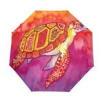 Parapluie pliant océan avec motif tortue stylisée, design artistique dégradé coloré, élégant et pratique pour les jours de pluie.