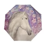 Parapluie pliant motif cheval blanc et fleurs de cerisier, élégant accessoire pour rester stylé et protégé sous la pluie.