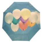 Parapluie romantique avec motifs de ballons colorés, idéal pour illuminer les journées pluvieuses. Accessoire tendance et pratique.