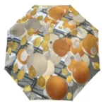 Parapluie romantique avec motifs de ballons jaunes, blancs et oranges, apportant une touche festive et lumineuse à votre style.