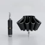 Parapluie tempête robuste noir, ouvert et plié, design élégant et résistant, idéal pour affronter les intempéries avec style.